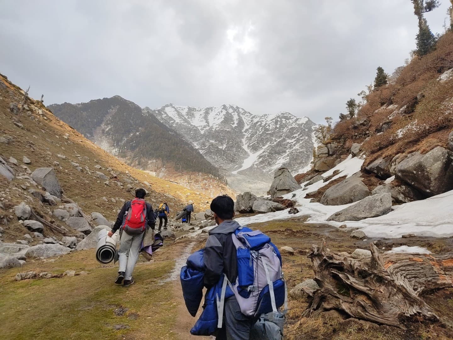 Kareri Lake reflecting surrounding peaks under a clear alpine sky