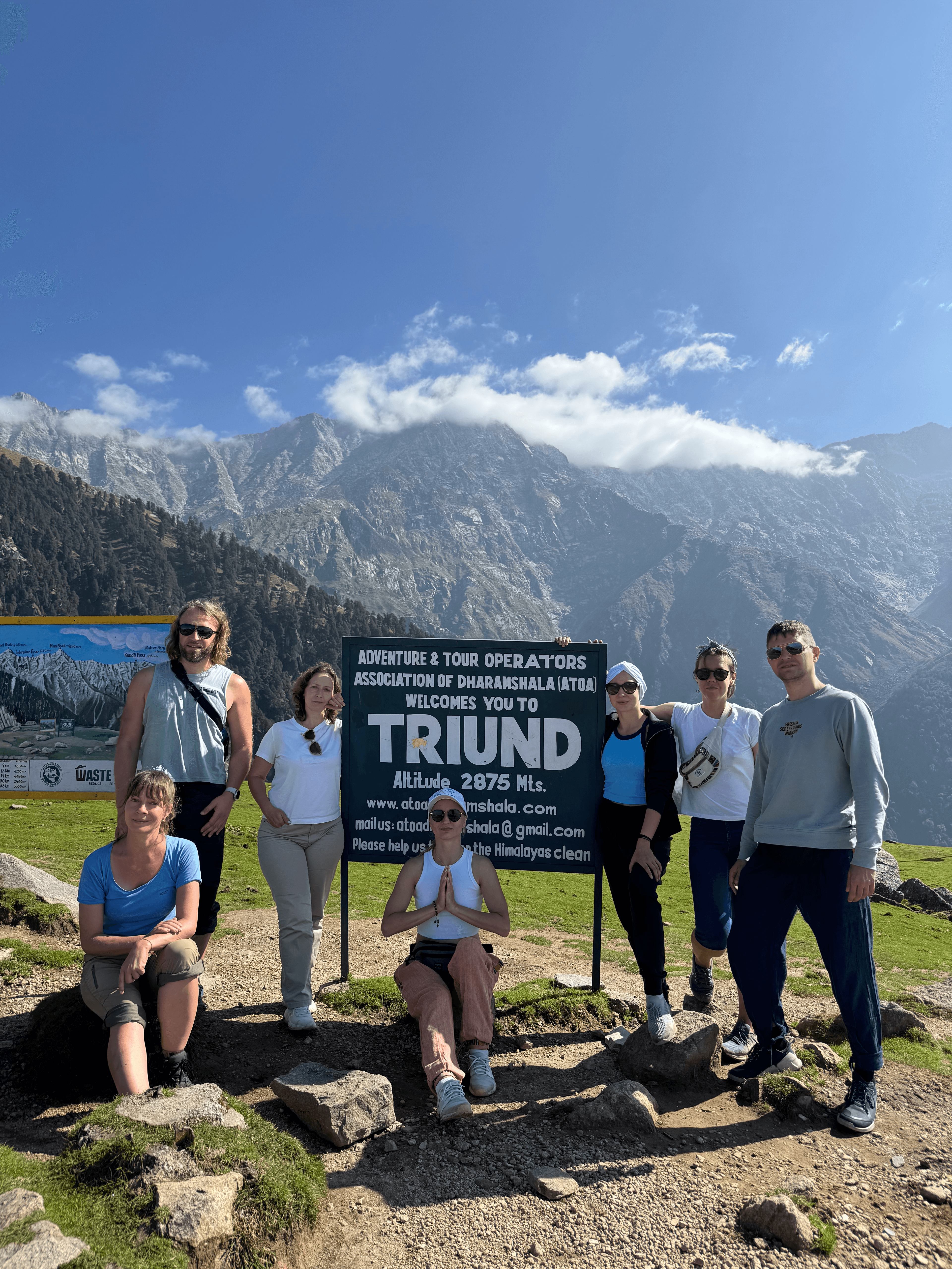 Tents pitched on Triund meadow with the Dhauladhar peaks glowing at sunset